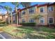 Attractive two-story building with stone accents and landscaping at 2220 Chianti Pl # 8-0812, Palm Harbor, FL 34683