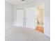 Spacious bedroom with carpet, double doors to closet, and en-suite bathroom at 2220 Chianti Pl # 8-0812, Palm Harbor, FL 34683