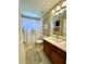 Bathroom featuring quartz counters, stylish shower curtain, and modern fixtures at 12384 Creek Edge Dr, Riverview, FL 33579