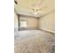 Spacious bedroom featuring plush carpeting, neutral paint, large window, and lots of natural light at 12384 Creek Edge Dr, Riverview, FL 33579