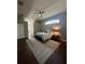 Cozy bedroom featuring modern ceiling fan, neutral color palette, and an abundance of natural light at 12384 Creek Edge Dr, Riverview, FL 33579