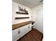 Home office features wood floor, shelves, and white cabinets at 12384 Creek Edge Dr, Riverview, FL 33579