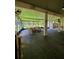 Enclosed patio features outdoor ceiling fans, outdoor seating and a view at 12384 Creek Edge Dr, Riverview, FL 33579