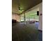 Enclosed patio with tile floor, ceiling fan, and furniture at 12384 Creek Edge Dr, Riverview, FL 33579