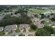 Aerial view of home showcasing the property and surrounding community with golf course at 2309 Mooney. Pl, Sun City Center, FL 33573