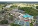 Expansive aerial view of the community showcasing multiple lakes, golf course, amenities and residences at 2309 Mooney. Pl, Sun City Center, FL 33573