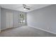 Bedroom with ceiling fan, carpeted floor and closet at 2309 Mooney. Pl, Sun City Center, FL 33573