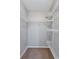 Spacious walk-in closet with carpet floors and plenty of shelving at 2309 Mooney. Pl, Sun City Center, FL 33573