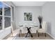 Dining room featuring modern table setting with chairs, stylish decor, and a large window at 2309 Mooney. Pl, Sun City Center, FL 33573