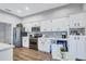 A kitchen with stainless steel appliances, white cabinets, a beverage cooler, and modern finishes at 2309 Mooney. Pl, Sun City Center, FL 33573
