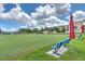 Immaculate lawn bowling green with benches and shaded seating, providing a recreational space at 2309 Mooney. Pl, Sun City Center, FL 33573