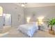 Main bedroom with a ceiling fan, decor, and access to the other rooms at 2309 Mooney. Pl, Sun City Center, FL 33573