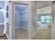 Open walk-in closet off of the main bedroom with shelving for ample storage at 2309 Mooney. Pl, Sun City Center, FL 33573