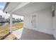 Covered back patio with tile ceiling and view of canal, boat dock, and waterfront homes at 3396 Minnow Creek Dr, Hernando Beach, FL 34607