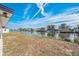 Scenic backyard with a beautiful waterfront view and neighboring upscale homes with boat docks at 3396 Minnow Creek Dr, Hernando Beach, FL 34607
