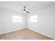 Light and airy bedroom featuring neutral walls, baseboards and light-colored wood floor at 3396 Minnow Creek Dr, Hernando Beach, FL 34607