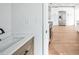 Stylish kitchen featuring stainless steel appliances, white cabinets, sleek hardware, and quartz countertops at 3396 Minnow Creek Dr, Hernando Beach, FL 34607