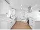 Bright kitchen with stainless steel appliances, quartz countertops, and a large island, perfect for cooking and entertaining at 3396 Minnow Creek Dr, Hernando Beach, FL 34607