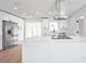 Bright kitchen features an island with a cooktop and stainless steel appliances at 3396 Minnow Creek Dr, Hernando Beach, FL 34607