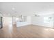 Bright living room featuring hardwood floors, recessed lighting, and a ceiling fan, creating an airy and inviting atmosphere at 3396 Minnow Creek Dr, Hernando Beach, FL 34607