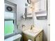 Bathroom featuring vanity and well-lit mirror and lighting at 35801 Verda Dr, Zephyrhills, FL 33541