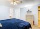 Comfortable bedroom featuring a cozy bed, dresser, and closet at 35801 Verda Dr, Zephyrhills, FL 33541