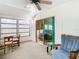 Bright sunroom with comfortable seating and sliding glass doors at 35801 Verda Dr, Zephyrhills, FL 33541