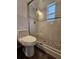 Elegant bathroom boasting a modern glass shower and pebble tile flooring at 3763 Dartmouth N Ave, St Petersburg, FL 33713