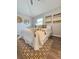 Cozy bedroom features a white bed, decorative artwork, and a patterned rug at 3763 Dartmouth N Ave, St Petersburg, FL 33713