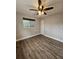 This bedroom features a neutral color palette and wood-look flooring at 3763 Dartmouth N Ave, St Petersburg, FL 33713