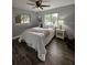 This bedroom features wood-look floors and natural light from the two windows at 3763 Dartmouth N Ave, St Petersburg, FL 33713
