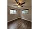 Bedroom with dark wood floor and two windows at 3763 Dartmouth N Ave, St Petersburg, FL 33713