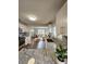 Bright kitchen featuring granite countertops, modern appliances, and a view to the living area at 3763 Dartmouth N Ave, St Petersburg, FL 33713