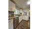 Well-lit kitchen featuring white cabinets, granite countertops, and stainless steel appliances at 3763 Dartmouth N Ave, St Petersburg, FL 33713