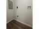 Small laundry room with dark wood floor and washer/dryer hook ups at 3763 Dartmouth N Ave, St Petersburg, FL 33713