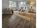 Bright living room with modern decor, hardwood floors, and ample natural light through large windows at 3763 Dartmouth N Ave, St Petersburg, FL 33713
