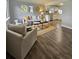 Open-concept living room and kitchen area featuring updated appliances and modern design at 3763 Dartmouth N Ave, St Petersburg, FL 33713