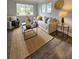 Stylish living room with a neutral color palette, chic rug, and plenty of comfortable seating at 3763 Dartmouth N Ave, St Petersburg, FL 33713
