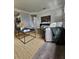 Comfortable living room with hardwood floors, modern decor, and a glimpse into other rooms at 3763 Dartmouth N Ave, St Petersburg, FL 33713