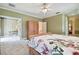 Cozy bedroom with access to an additional room, perfect for creating a private suite at 6527 Stonington Dr, Tampa, FL 33647