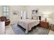 This bedroom features light filled windows, neutral walls, and a patterned area rug at 6527 Stonington Dr, Tampa, FL 33647