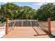 Spacious deck overlooking a scenic backyard with lush greenery at 6527 Stonington Dr, Tampa, FL 33647