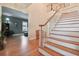 Welcoming entryway featuring hardwood floors and a staircase leading to the second floor at 6527 Stonington Dr, Tampa, FL 33647