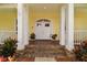 Inviting front porch with brick steps, sturdy columns, and a double-door entry at 6527 Stonington Dr, Tampa, FL 33647