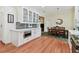 Bright kitchen featuring white cabinets, stainless steel appliances, and an adjacent dining area at 6527 Stonington Dr, Tampa, FL 33647