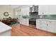 Well-designed kitchen with stainless steel appliances and adjacent dining area for convenience at 6527 Stonington Dr, Tampa, FL 33647