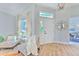 Bright and airy entryway with hardwood floors and stained-glass window at 2309 Mooney. Pl, Sun City Center, FL 33573