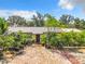 Ranch style home with brick driveway, lush landscaping, and a spacious front yard at 4300 41St N St, St Petersburg, FL 33714