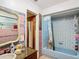 Bathroom with blue tiled shower and vanity at 4300 41St N St, St Petersburg, FL 33714
