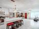 Open concept kitchen with island, stainless steel appliances, and white cabinetry at 4300 41St N St, St Petersburg, FL 33714